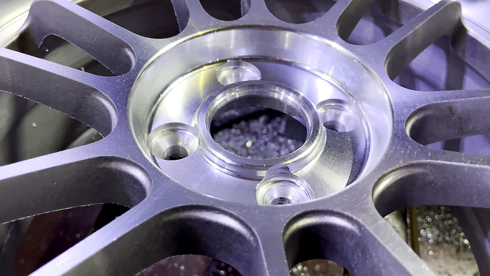 RAYONE machined wheel center detail after CNC finishing